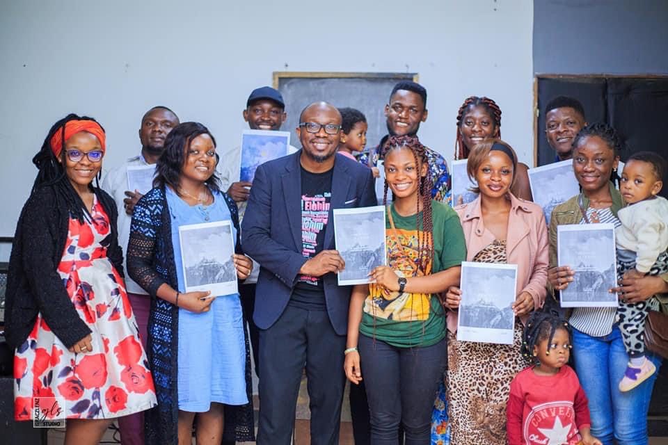 Leadership Academy cohort with Dr. Ekobena distributing materials