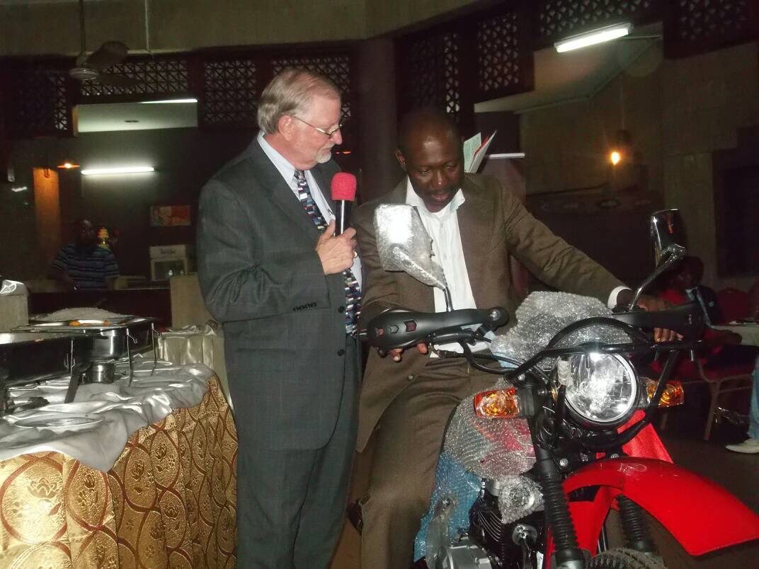 Motorcycle donation to mobile village messengers