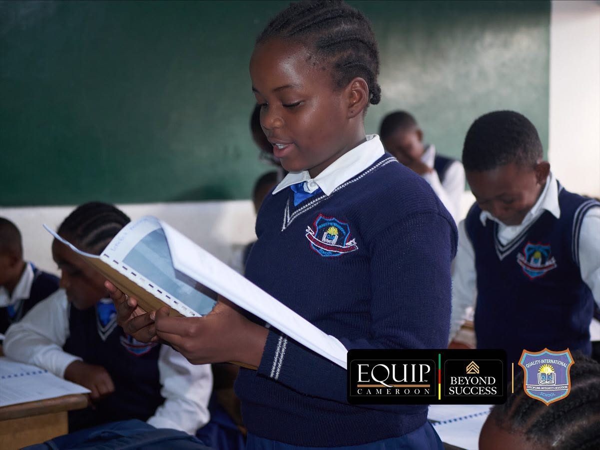 Student reading the AFRILEAD leadership manual in class